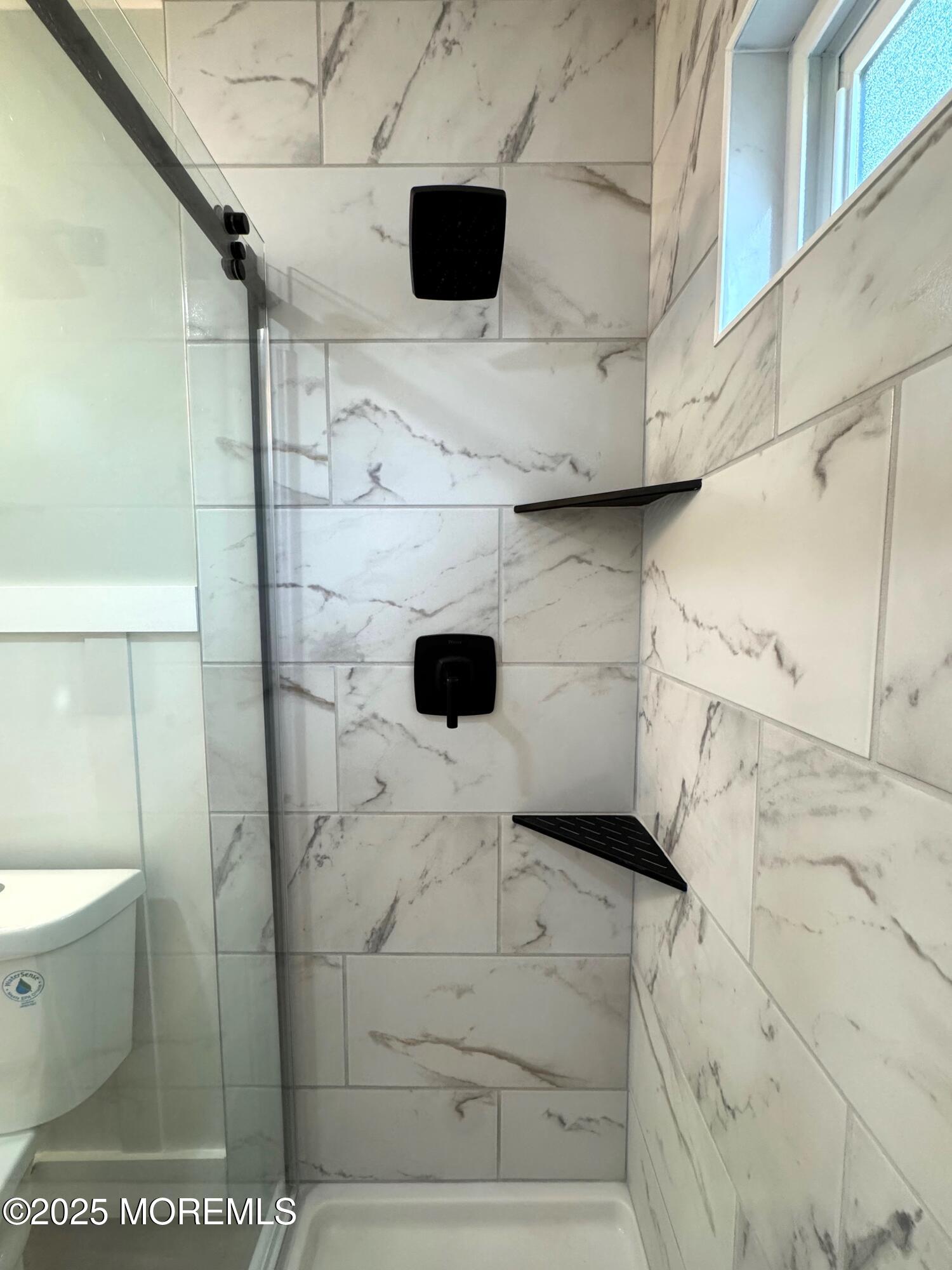 5 Nevada Drive Whiting, NJ 08759 - Photo 25 of 44 a bathroom with a toilet and a shower