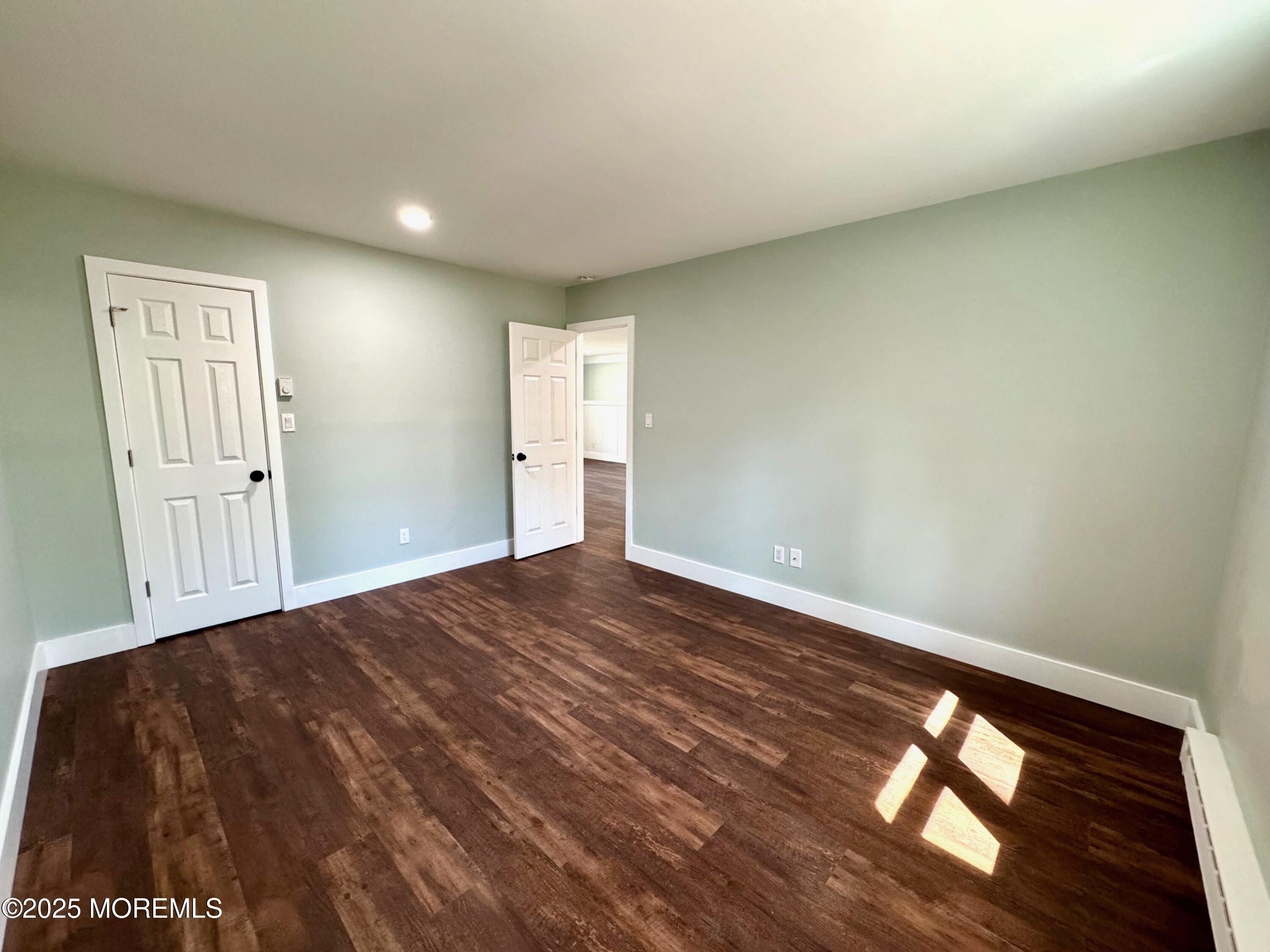 5 Nevada Drive Whiting, NJ 08759 - Photo 33 of 44 a view of empty room with wooden floor