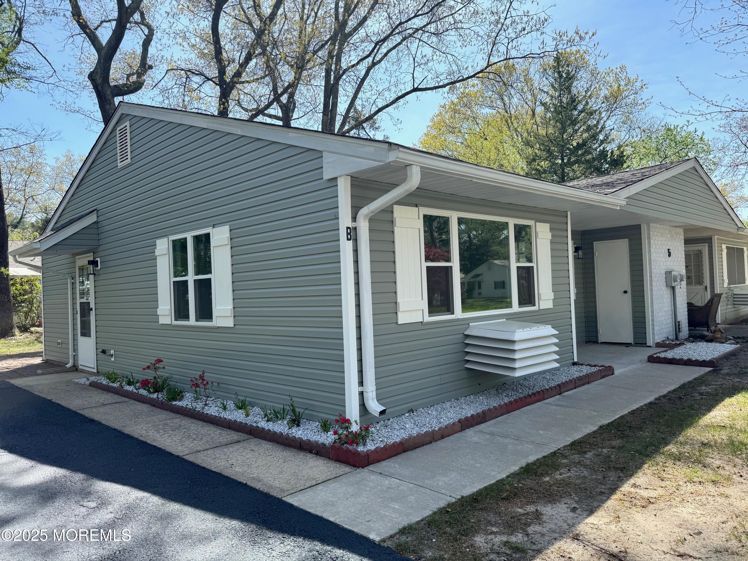 5 Nevada Drive Whiting, NJ 08759 - Photo 5 of 44 a front view of a house with yard