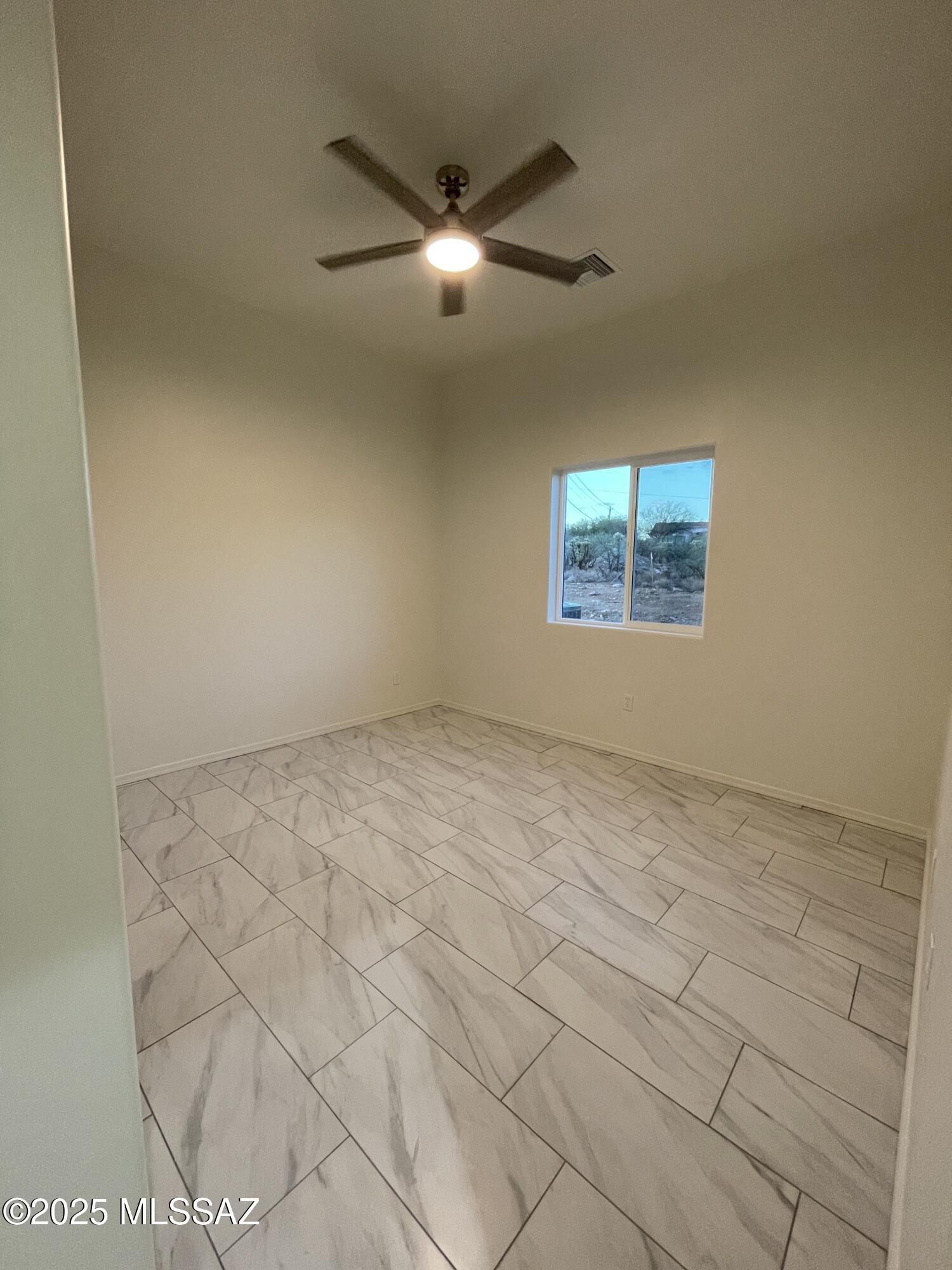 87 Avenida Pastor Rio Rico, AZ 85648 - Photo 19 of 24 a view of an empty room with a window