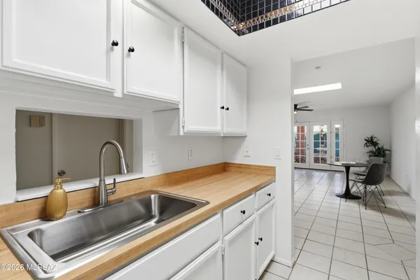 a kitchen with a sink cabinets and appliances