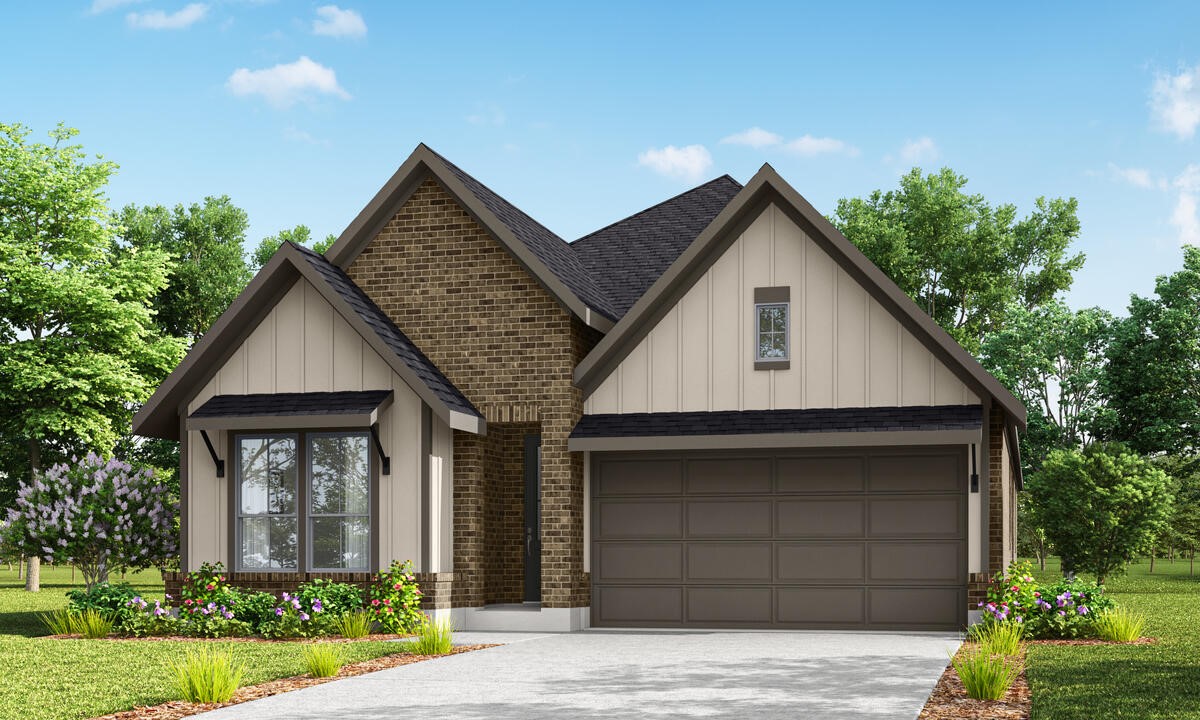 a front view of a house with garage