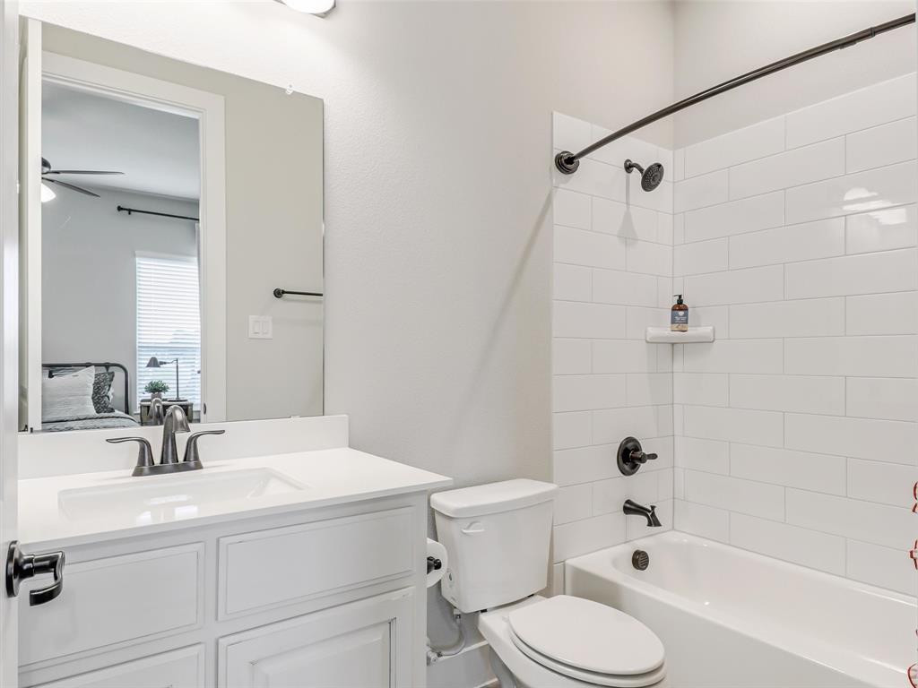 544 Majors Road Van Alstyne, TX 75495 - Photo 28 of 36 a bathroom with a sink toilet a shower and bathtub