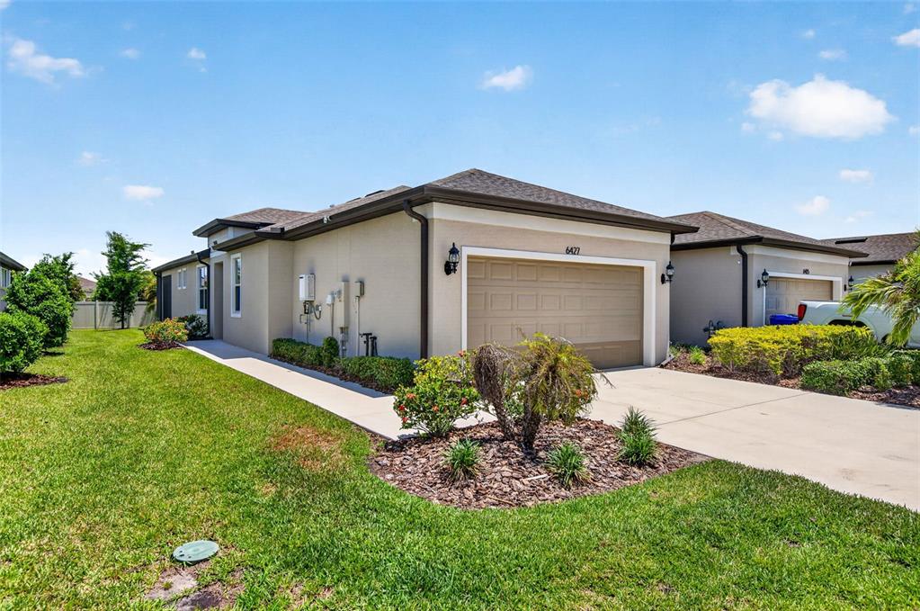 6427 Mooring Line Circle Apollo Beach, FL 33572 - Photo 7 of 34 a front view of house with a garden