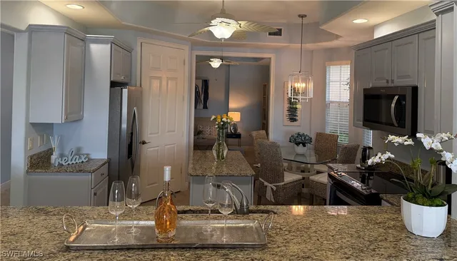 a lobby with furniture and a potted plant