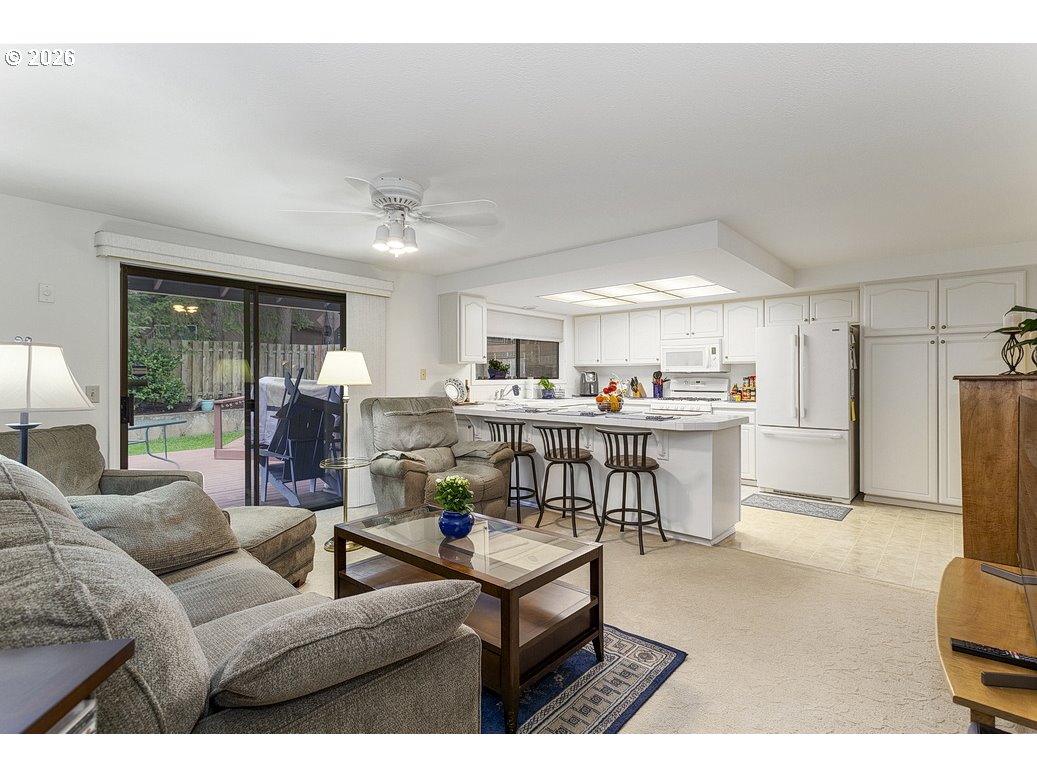 3788 Southeast 25th Street Gresham, OR 97080 - Photo 14 of 35 a living room with lots of furniture and kitchen view