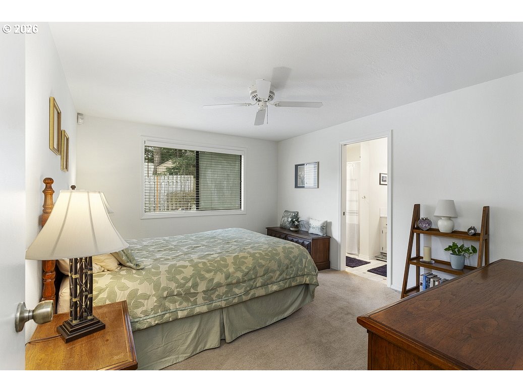 3788 Southeast 25th Street Gresham, OR 97080 - Photo 16 of 35 a bed room with a bed and a table