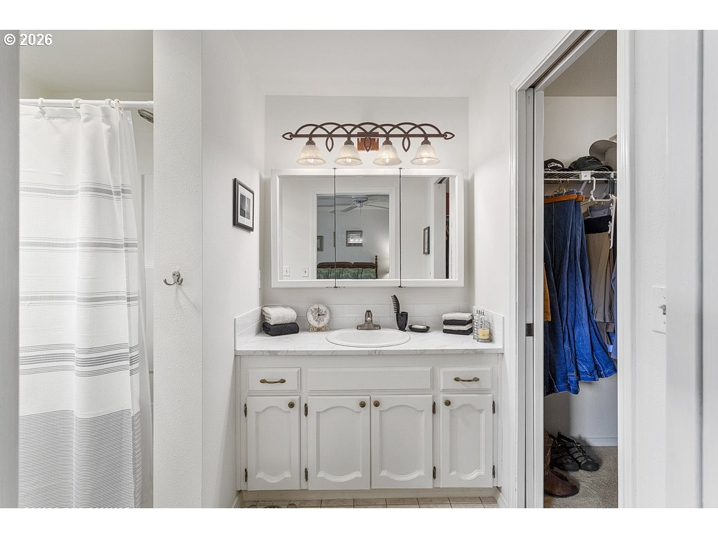 3788 Southeast 25th Street Gresham, OR 97080 - Photo 18 of 35 a bathroom with a sink vanity and a mirror