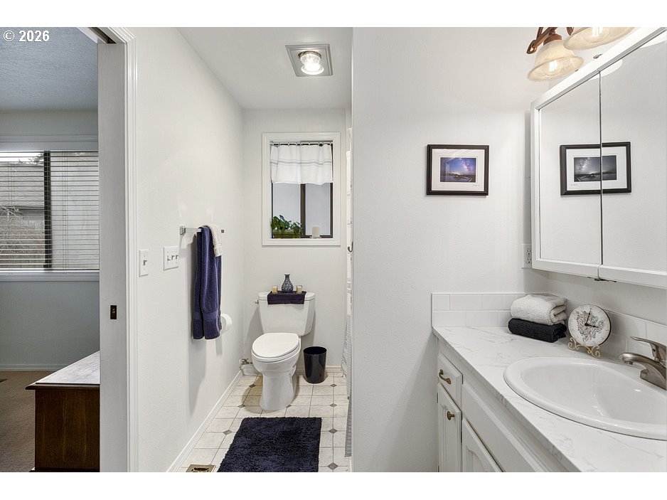 3788 Southeast 25th Street Gresham, OR 97080 - Photo 19 of 35 a bathroom with a sink vanity and mirror