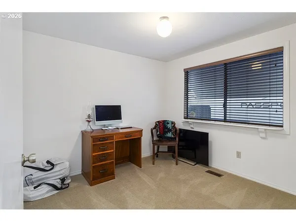 a room with furniture and a window