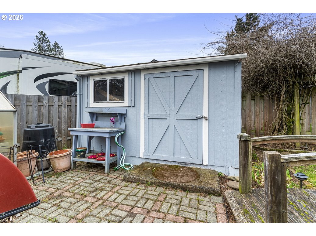 3788 Southeast 25th Street Gresham, OR 97080 - Photo 28 of 35 a backyard of a house with table and chairs