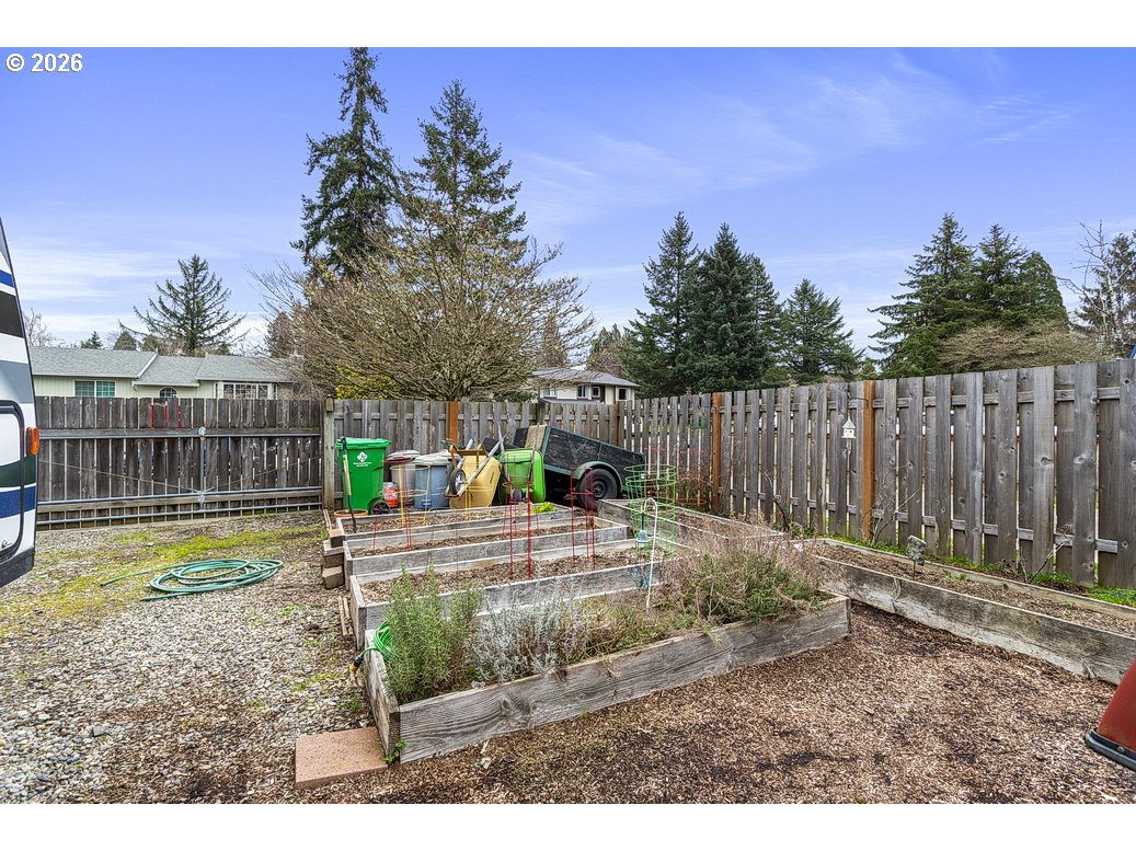 3788 Southeast 25th Street Gresham, OR 97080 - Photo 29 of 35 a view of a backyard with wooden fence