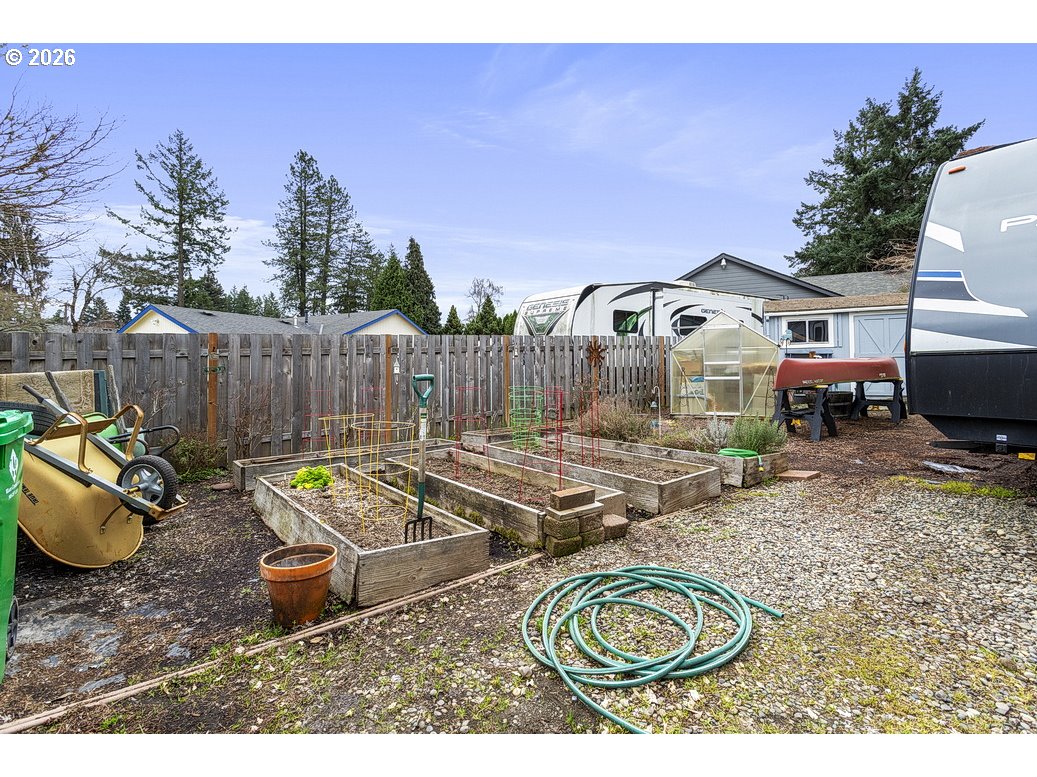 3788 Southeast 25th Street Gresham, OR 97080 - Photo 30 of 35 a view of a backyard with couches chair and wooden floor