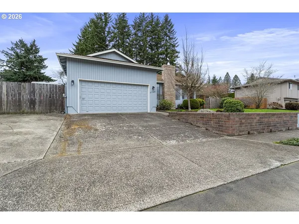 a view of a house with a small yard