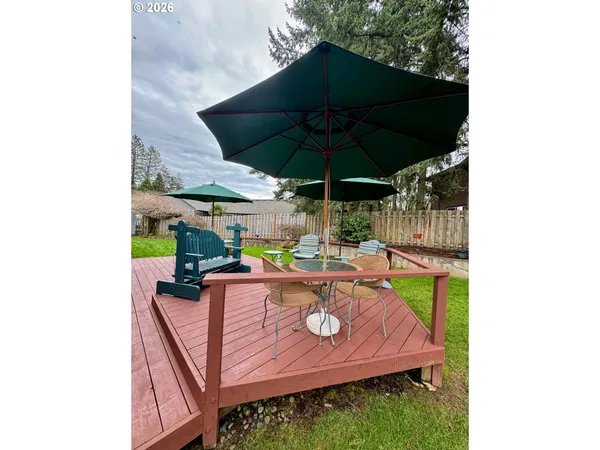 a view of a backyard with a garden and trees
