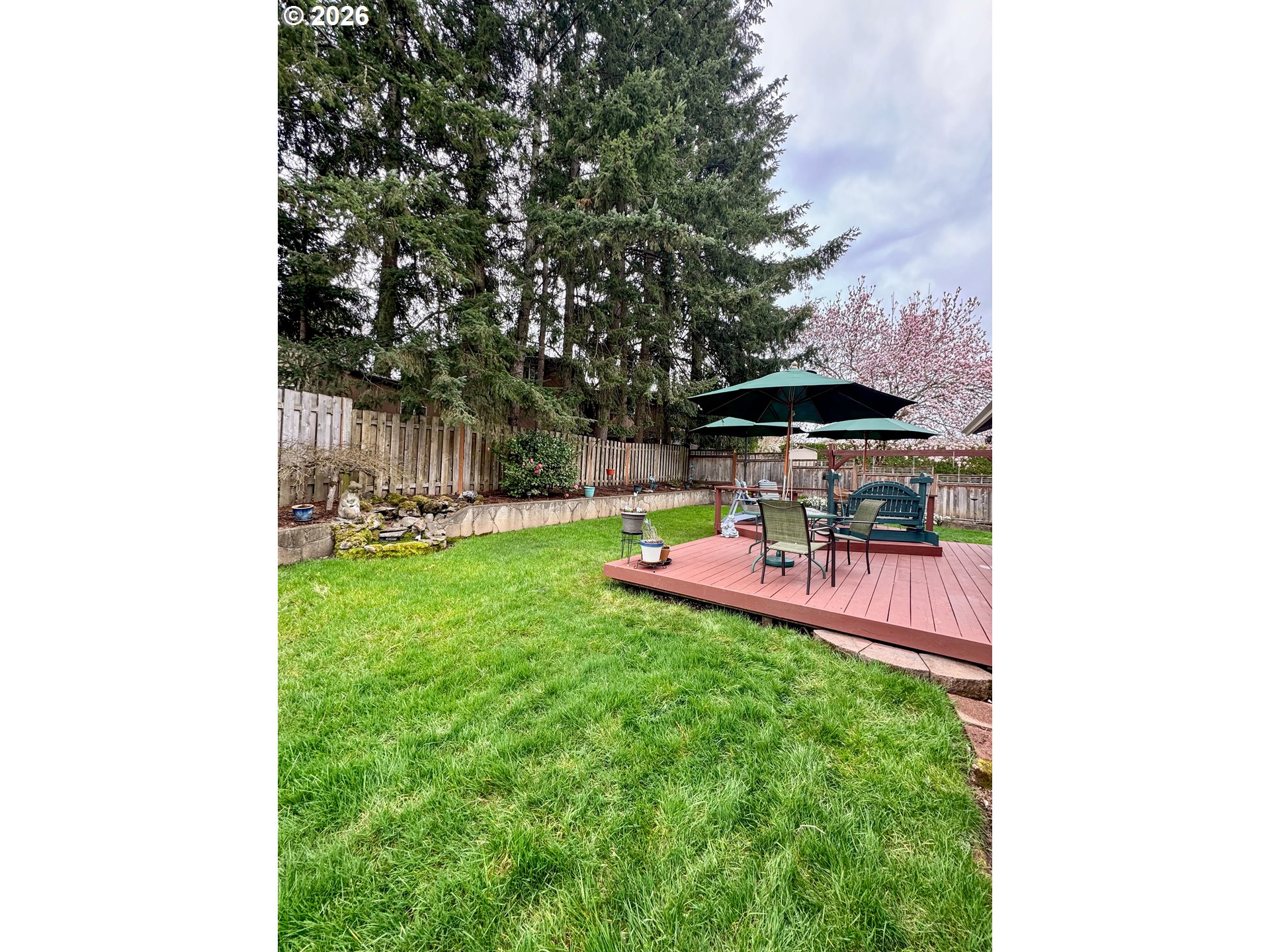 3788 Southeast 25th Street Gresham, OR 97080 - Photo 34 of 35 a view of a backyard with a garden and trees