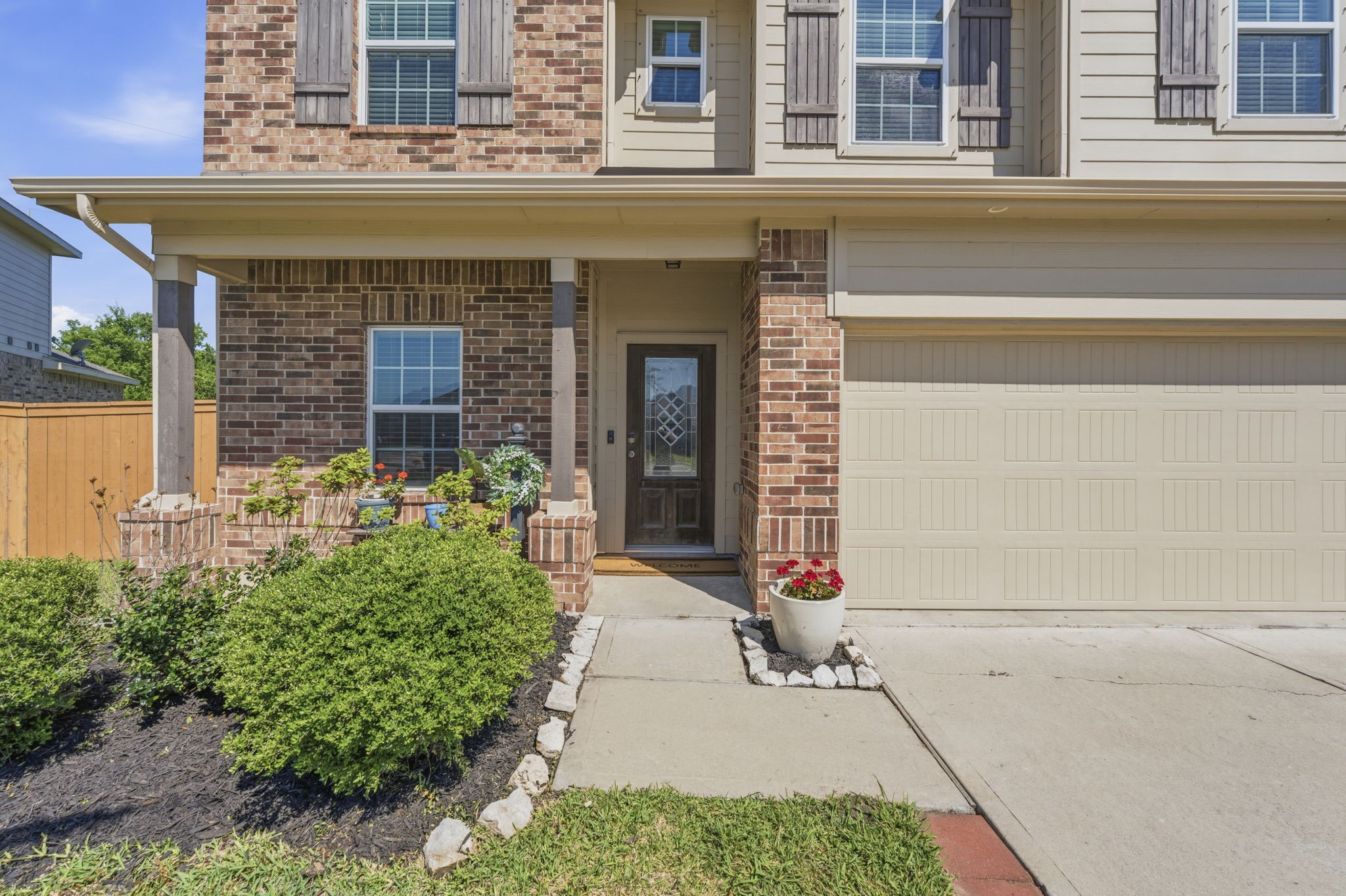 2401 Abbot Brk Drive Rosharon, TX 77583 - Photo 4 of 50 From the moment you arrive, this home’s striking beauty and inviting character make a lasting impression, highlighted by an elegant front door and charming wood-pillared front porch that create a warm and welcoming entrance.
