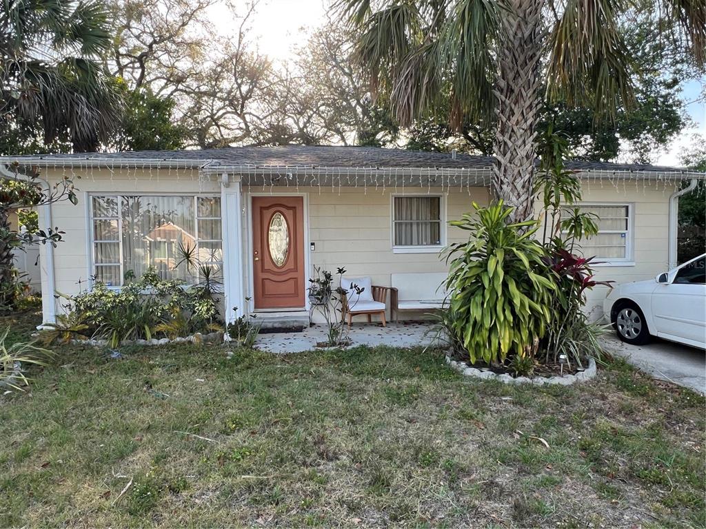 Undisclosed Address Tampa, FL 33604 - Photo 1 of 1 a view of a house with backyard and trees
