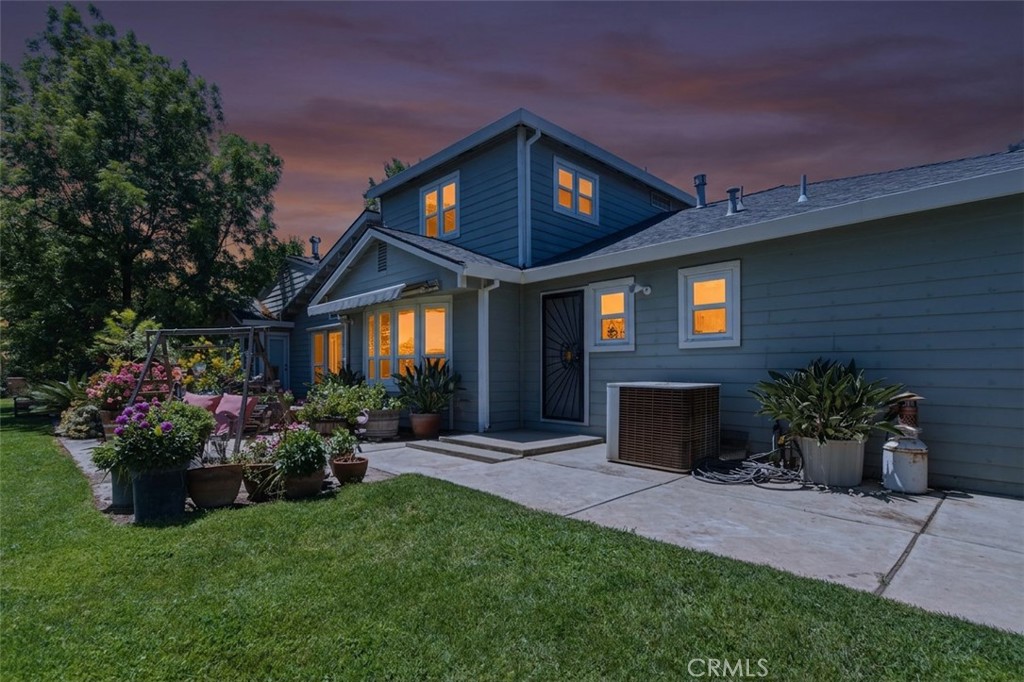 3856 North Gardner Avenue Merced, CA 95340 - Photo 2 of 59 a front view of a house with a garden