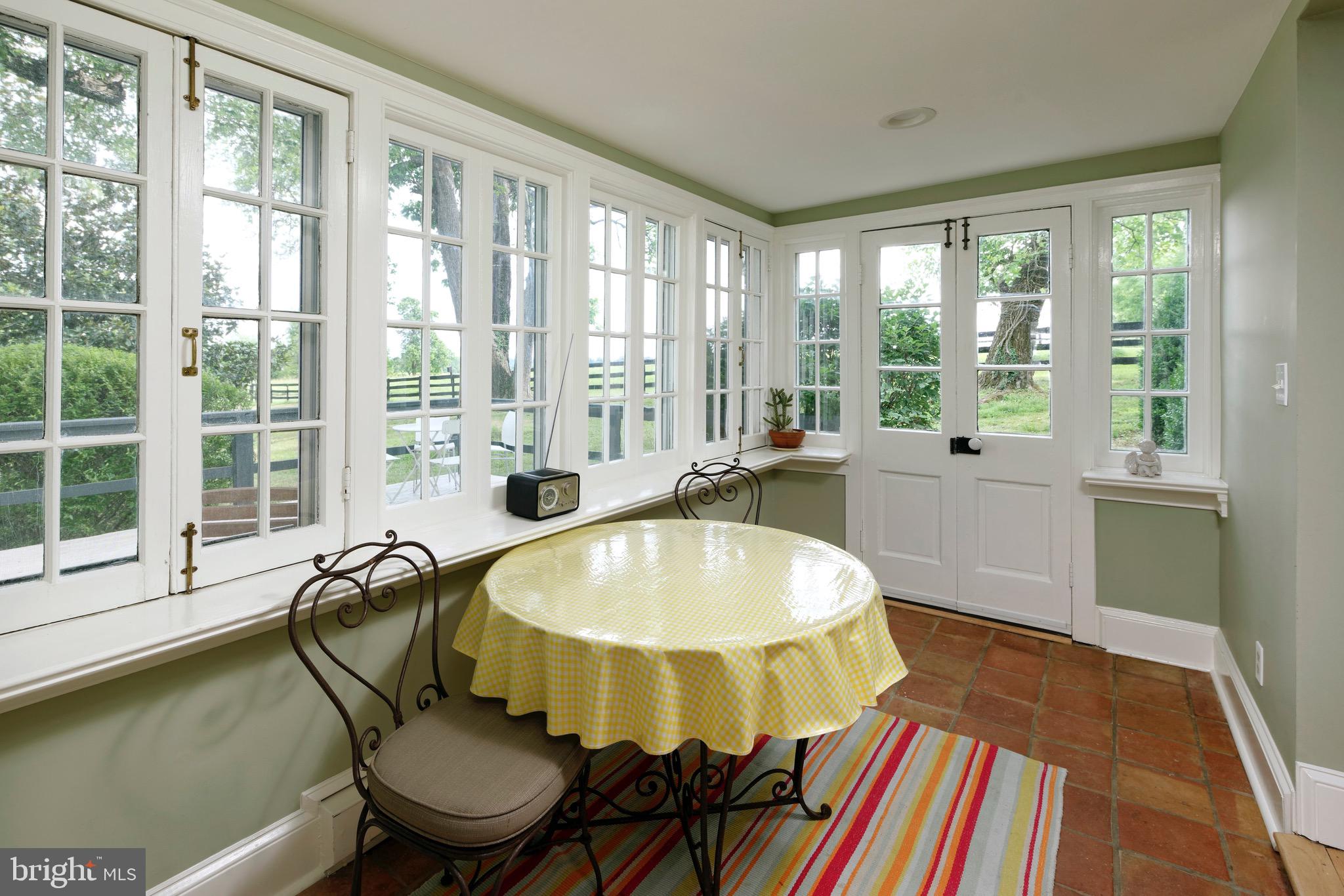 21896 Pot House Road Middleburg, VA 20117 - Photo 34 of 70 Enclosed side porch with space for a table