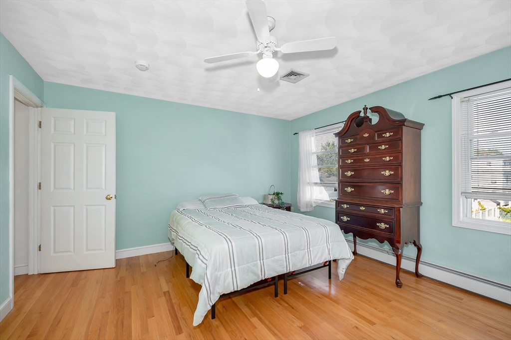 7 Marie Street Methuen, MA 01844 - Photo 26 of 39 a bedroom with a bed a dresser and a window