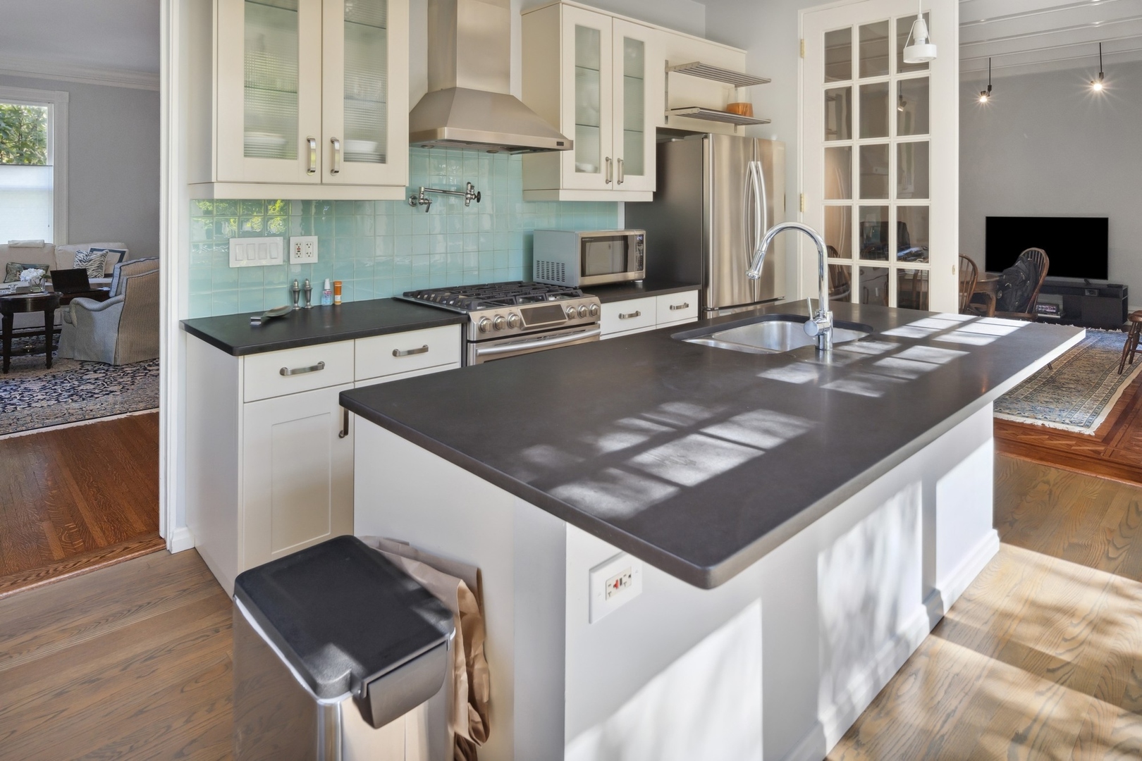 415 East Deerpath Road Lake Forest, IL 60045 - Photo 9 of 26 a kitchen with kitchen island granite countertop a sink stove and refrigerator
