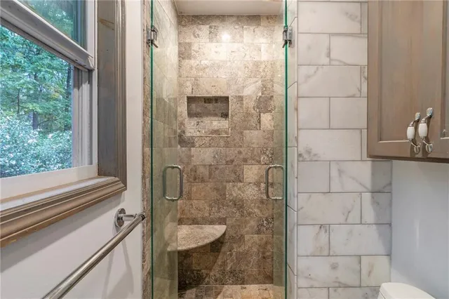 a view of an empty room and wooden floor