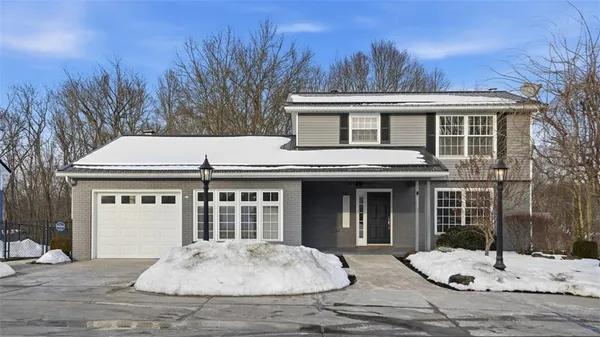 a front view of a house with a yard