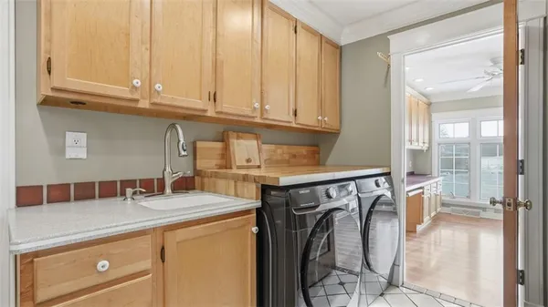 a kitchen with a sink and cabinets