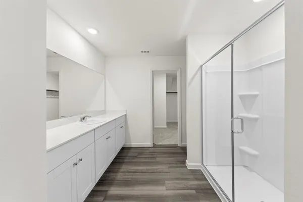 a bathroom with a double vanity sink and mirror