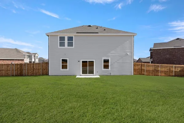 a big house with a yard and more windows