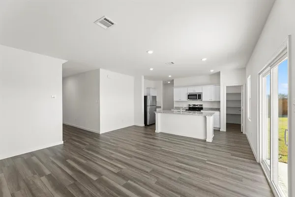 a view of kitchen with wooden floor