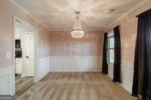 a living room with furniture a fireplace and a window