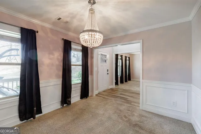 a living room with furniture and a ceiling fan