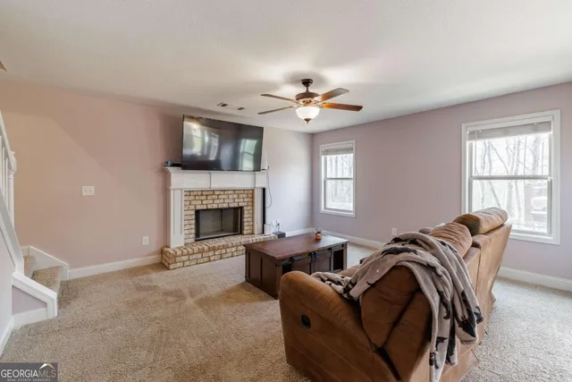a living room with furniture and a table