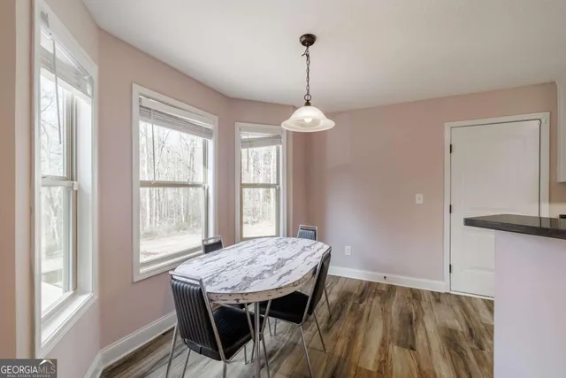 a kitchen with a sink stove and refrigerator