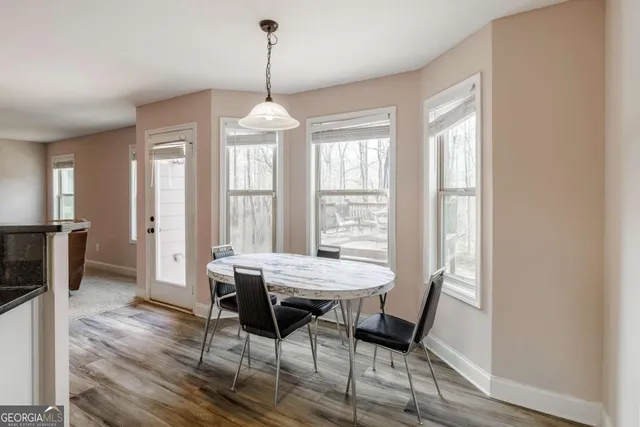 a kitchen with stainless steel appliances granite countertop a stove a refrigerator and a microwave