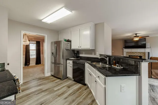 a view of an entryway with wooden floor