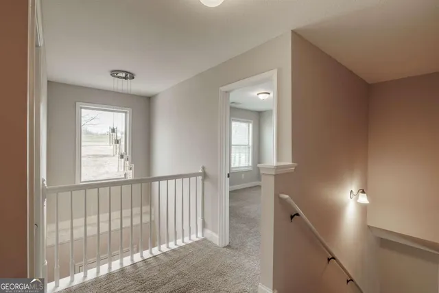 a bedroom with a bed and a chair