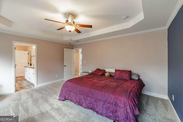 a bathroom with a toilet and a shower curtain