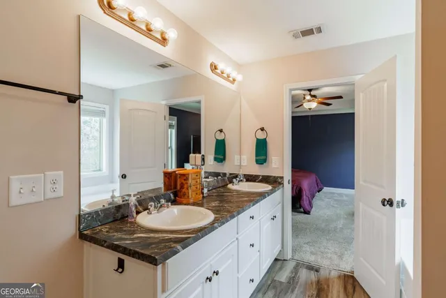 a living room with a bed furniture and a window