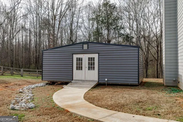 a view of a forest with sitting area