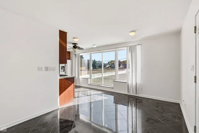 a view of a house with a cars park