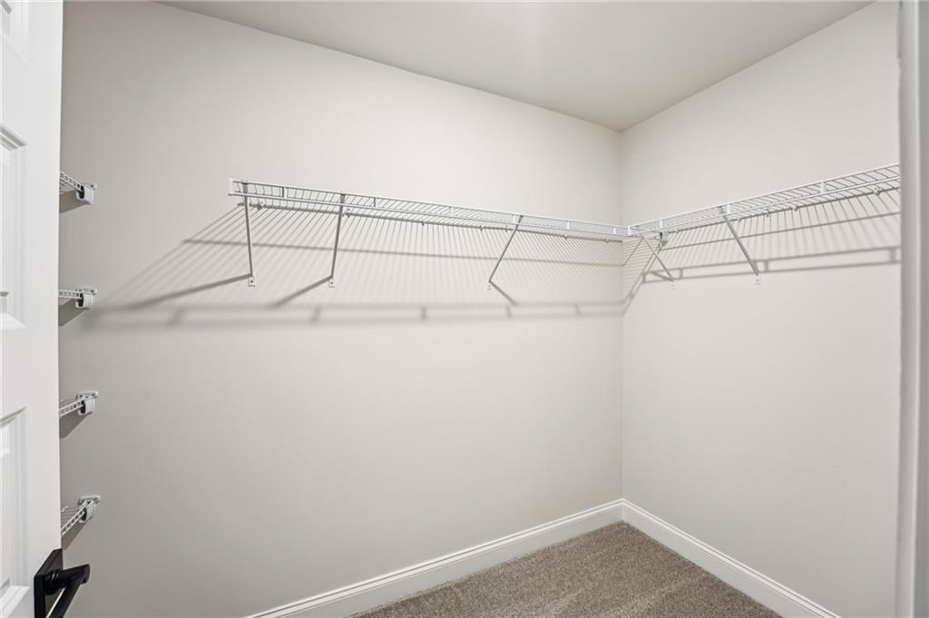 6450 Pinin Place Cumming, GA 30041 - Photo 47 of 53 a view of a room with racks on the wall