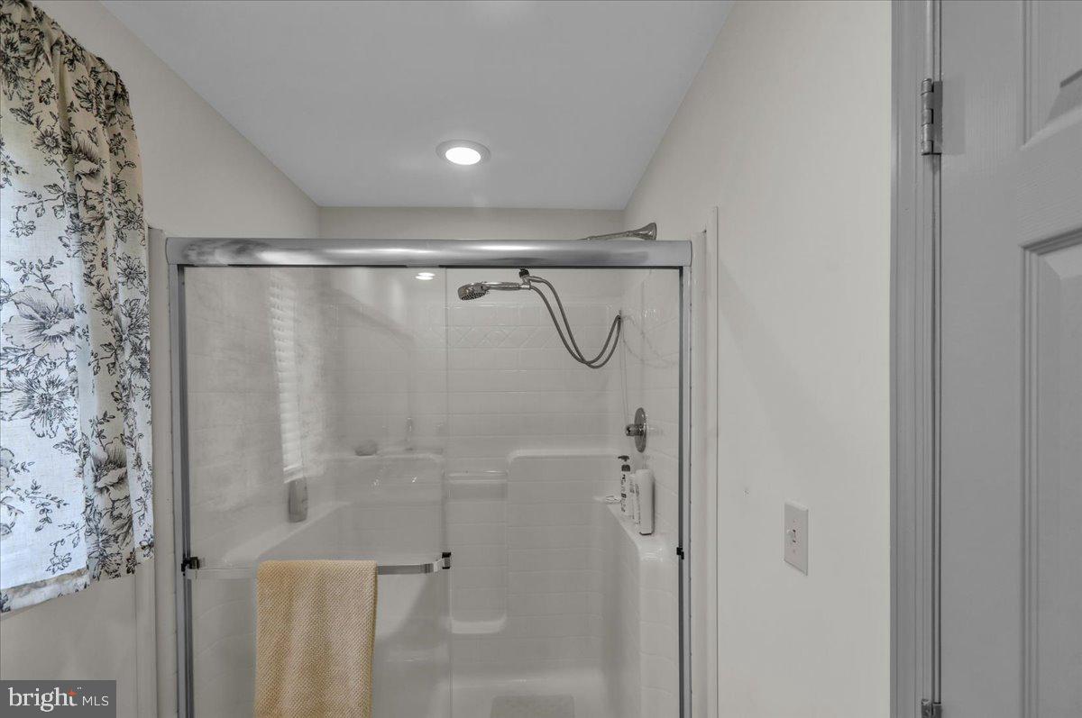 132 Strausser Road Hamburg, PA 19526 - Photo 16 of 67 a bathroom with a glass shower door