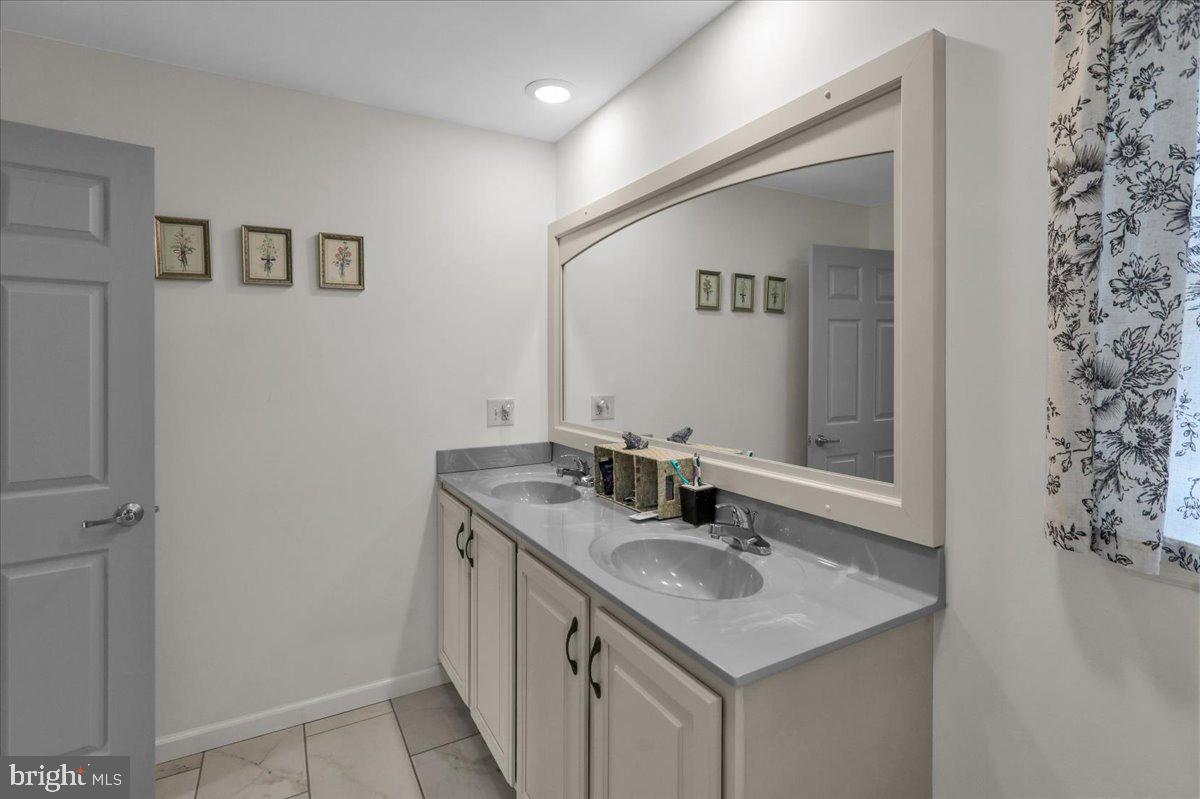 132 Strausser Road Hamburg, PA 19526 - Photo 18 of 67 a bathroom with a granite countertop sink and a mirror
