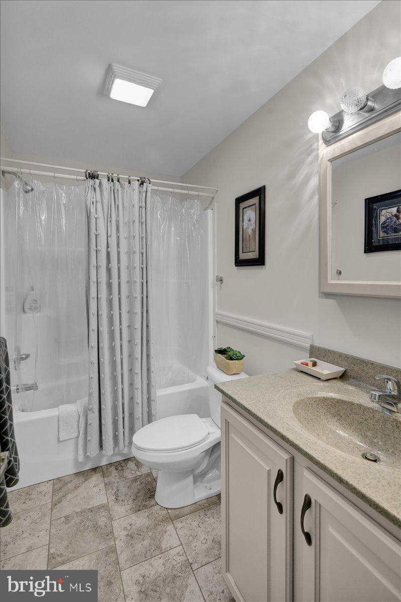 132 Strausser Road Hamburg, PA 19526 - Photo 23 of 67 a bathroom with a granite countertop sink toilet a mirror and shower