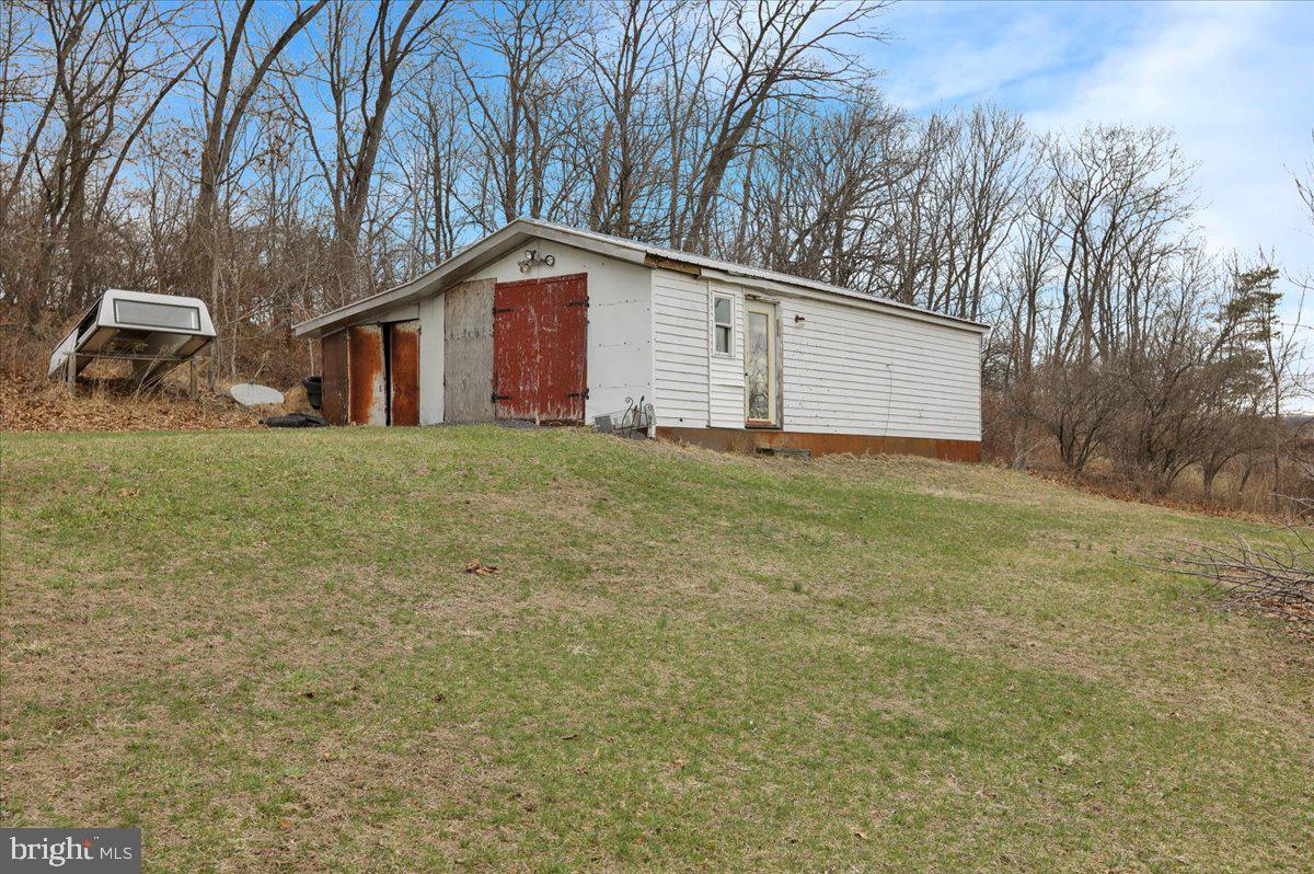 132 Strausser Road Hamburg, PA 19526 - Photo 41 of 67 a big house with a big yard and large trees