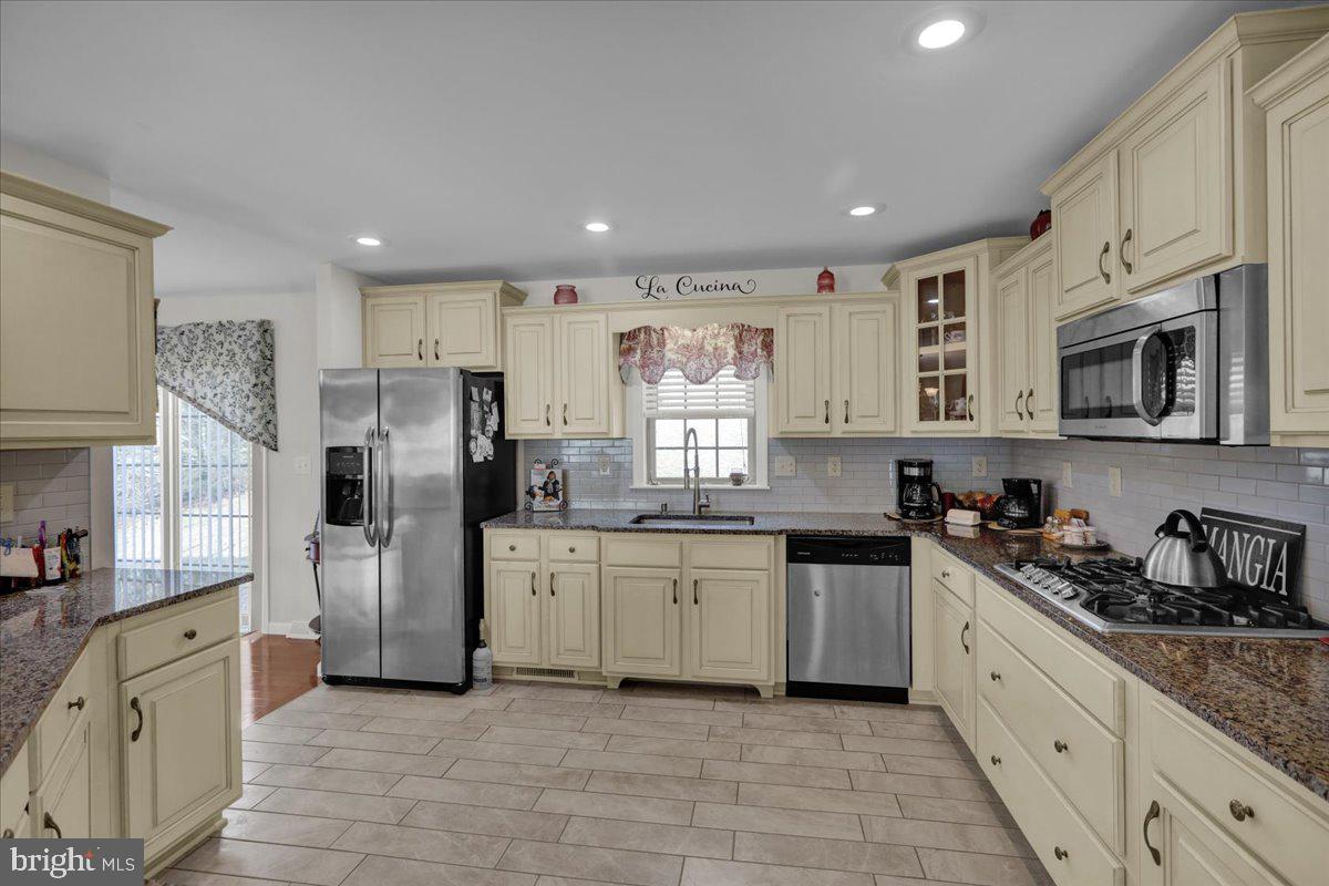 132 Strausser Road Hamburg, PA 19526 - Photo 9 of 67 a large kitchen with stainless steel appliances granite countertop a refrigerator and a stove top oven