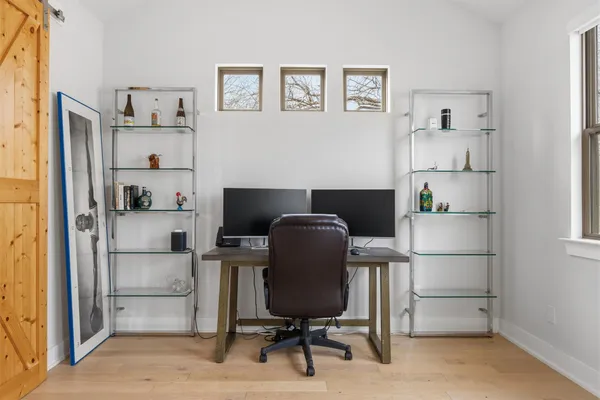 a workspace with furniture and a window